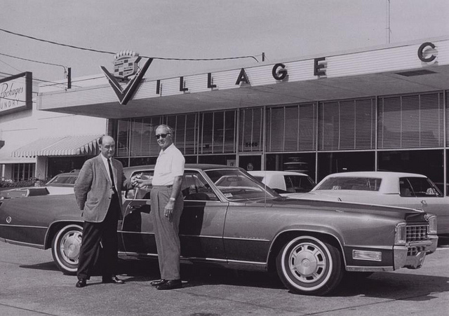Car Salesman Speaks With Manager